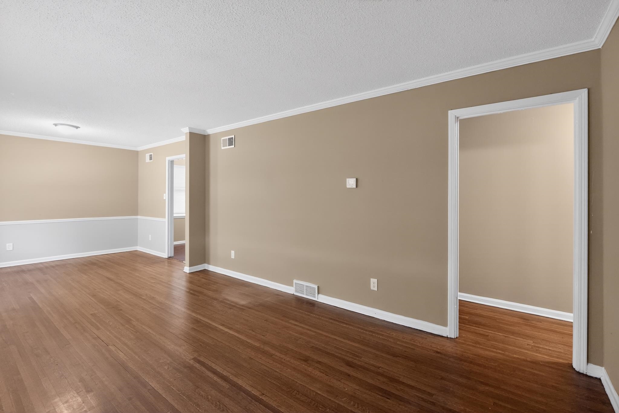 2015 East Holmes Road Memphis, TN 38116 - Photo 16 of 34 a view of an empty room with wooden floor