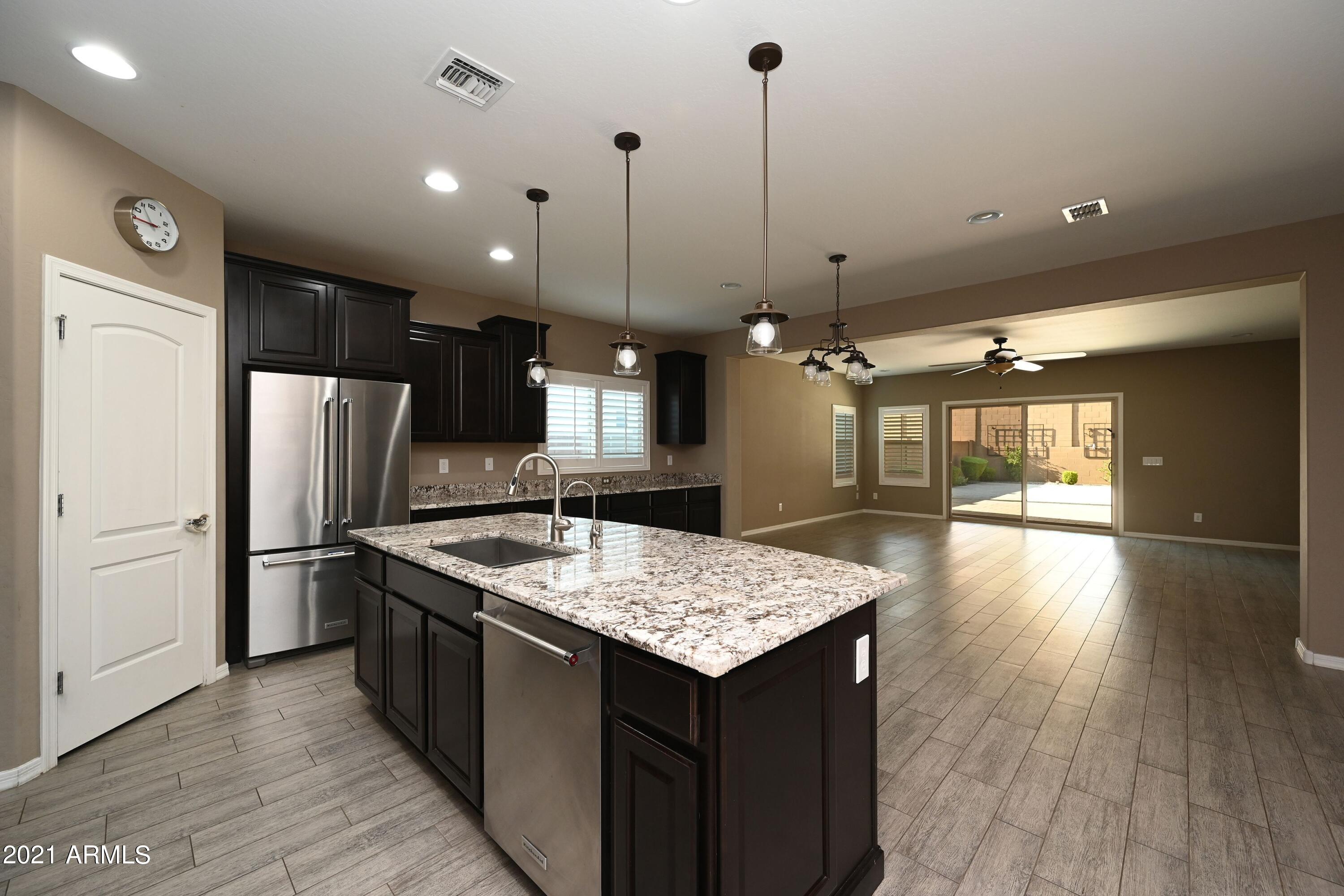 2624 West Rabjohn Road Phoenix, AZ 85085 - Photo 6 of 29 feureisen-kitchen to great room