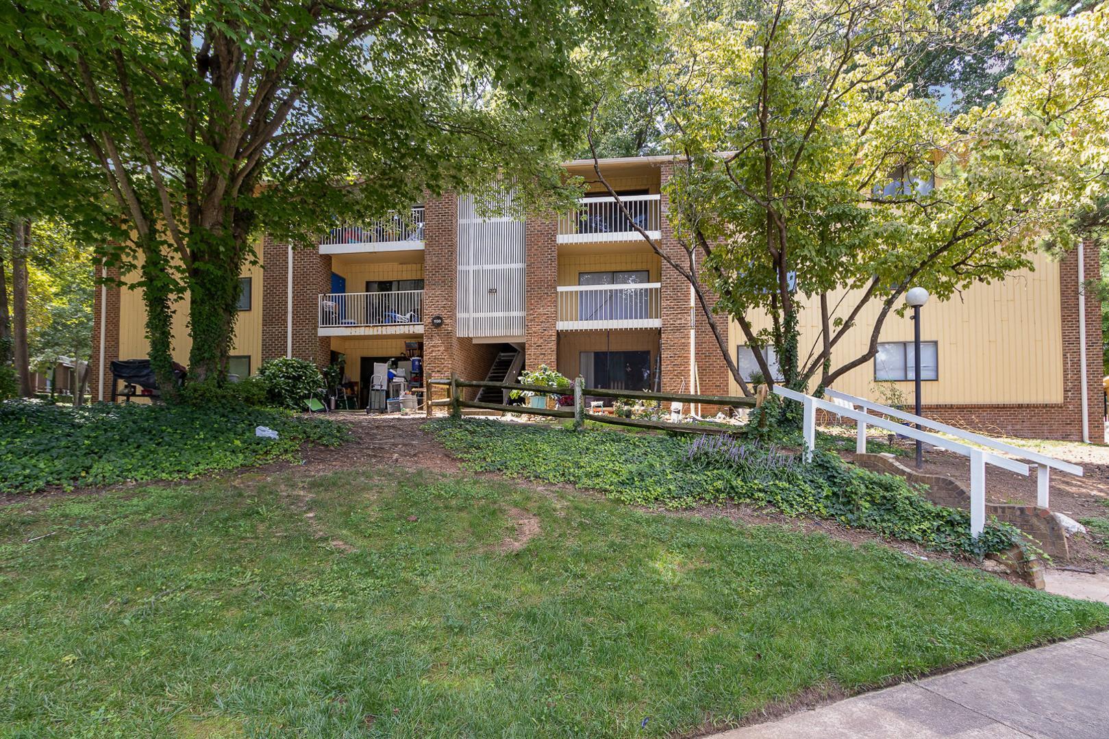 1130 Schaub Drive, Unit C Raleigh, NC 27606 - Photo 1 of 25 a view of house with yard