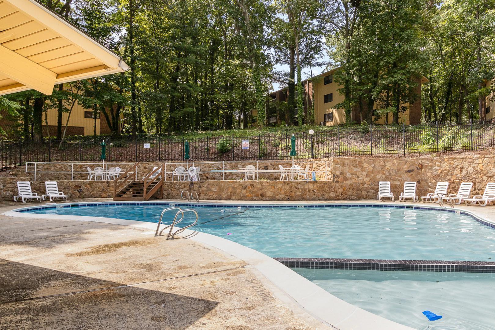 1130 Schaub Drive, Unit C Raleigh, NC 27606 - Photo 24 of 25 a view of a swimming pool with an outdoor space