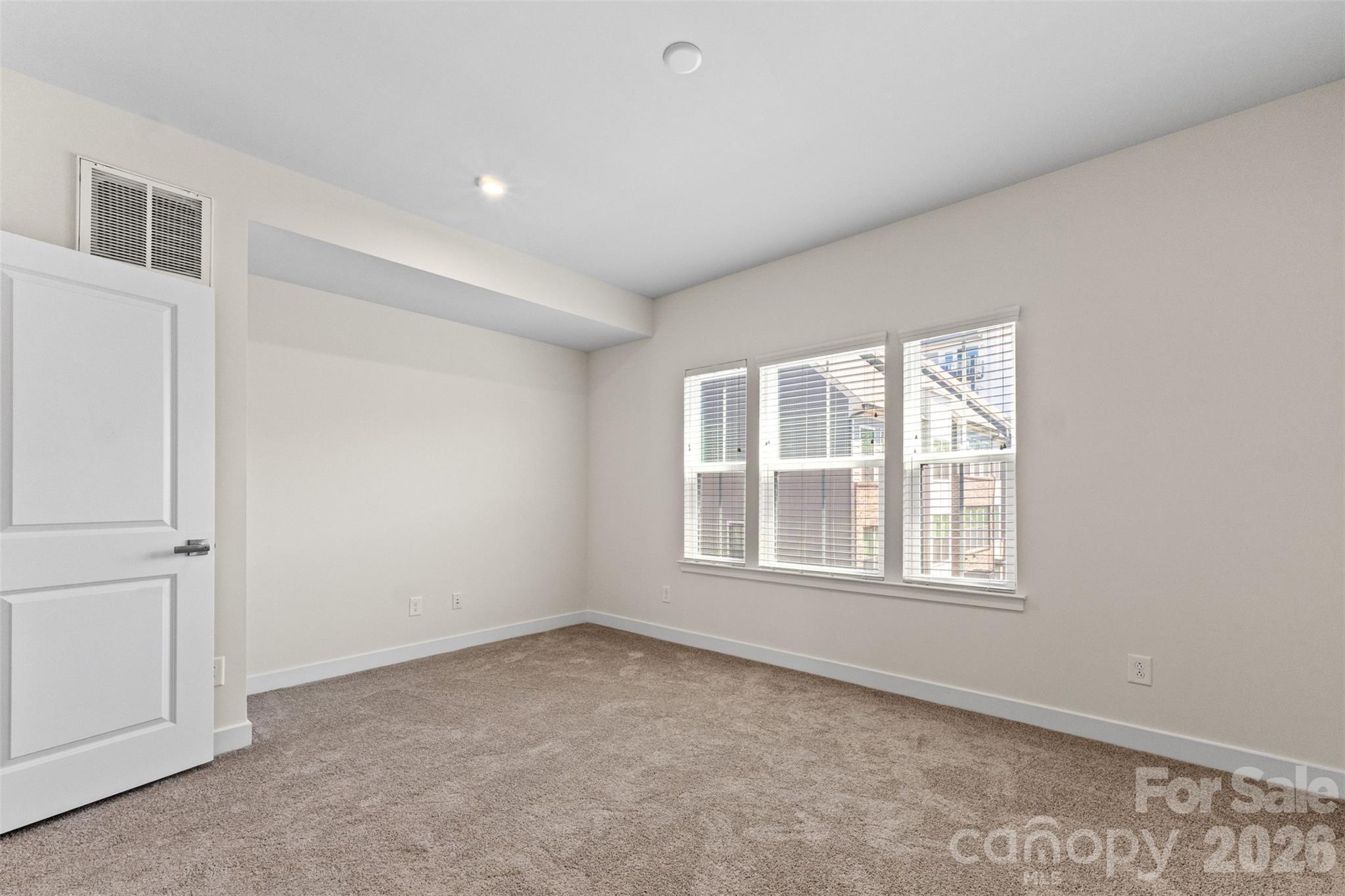 3645 South Tryon Street Charlotte, NC 28217 - Photo 19 of 45 an empty room with a window