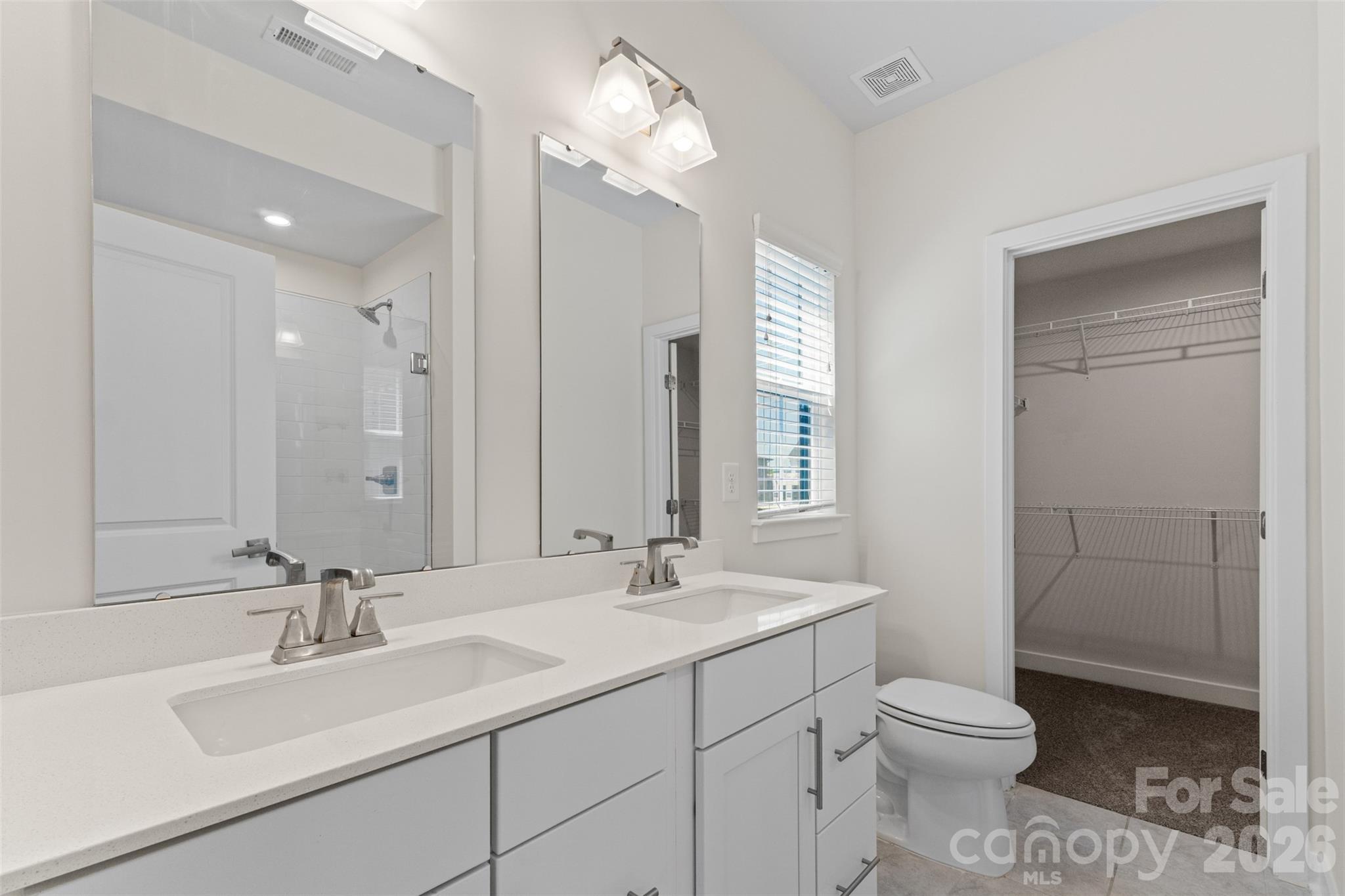 3645 South Tryon Street Charlotte, NC 28217 - Photo 20 of 45 a bathroom with a sink a toilet and shower
