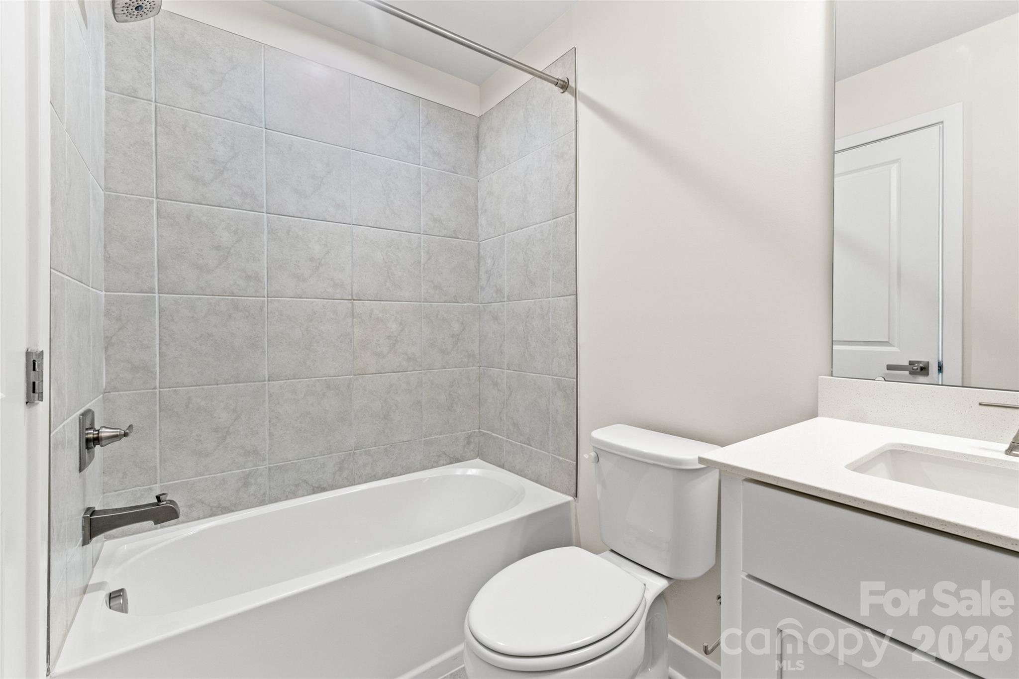 3645 South Tryon Street Charlotte, NC 28217 - Photo 25 of 45 a bathroom with a sink a toilet and a bathtub