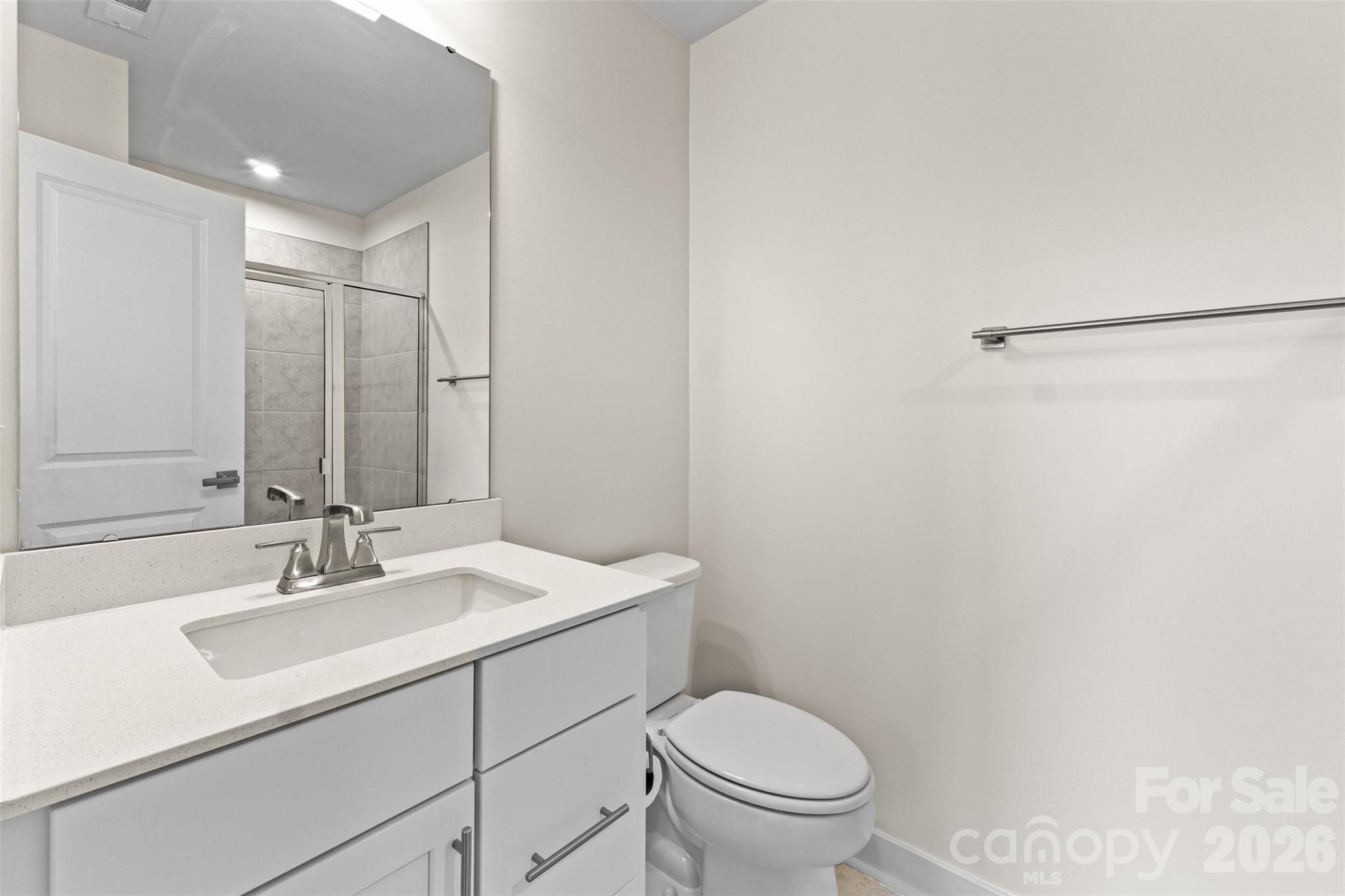 3645 South Tryon Street Charlotte, NC 28217 - Photo 29 of 45 a bathroom with a sink toilet and vanity