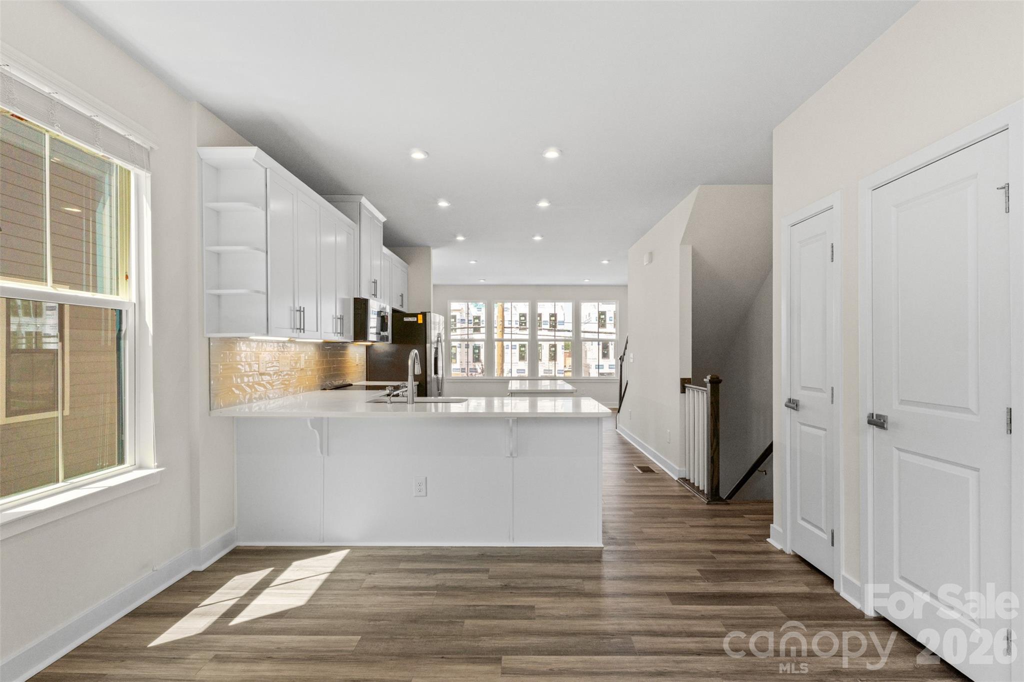 3645 South Tryon Street Charlotte, NC 28217 - Photo 10 of 45 a kitchen with stainless steel appliances granite countertop a refrigerator and a sink