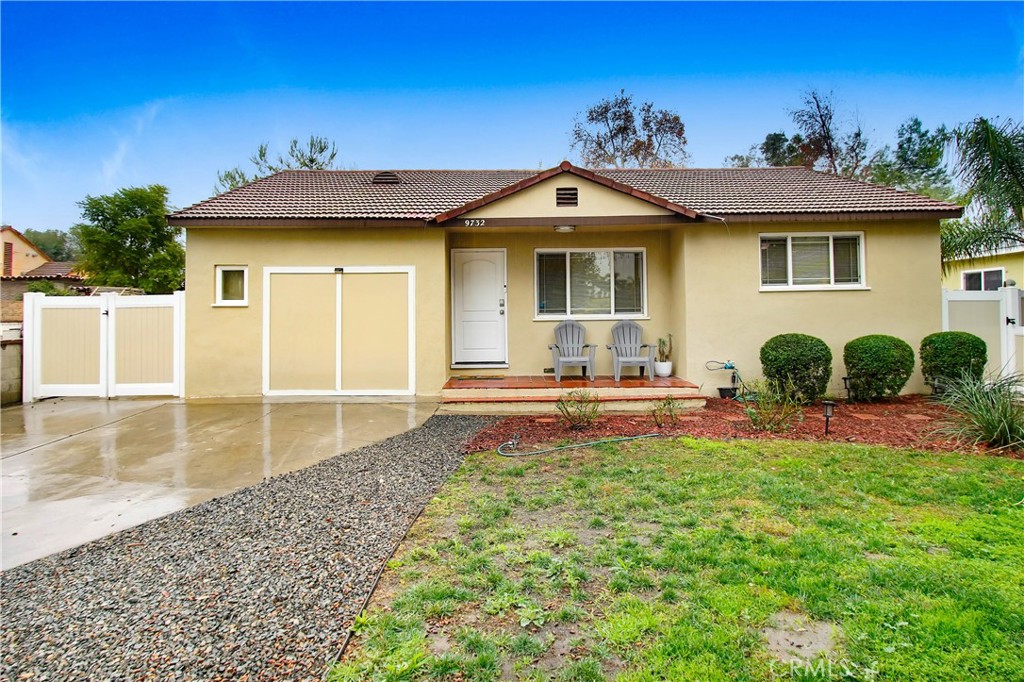 9732 Belmont Drive Riverside, CA 92503 - Photo 1 of 20 a front view of a house with garden