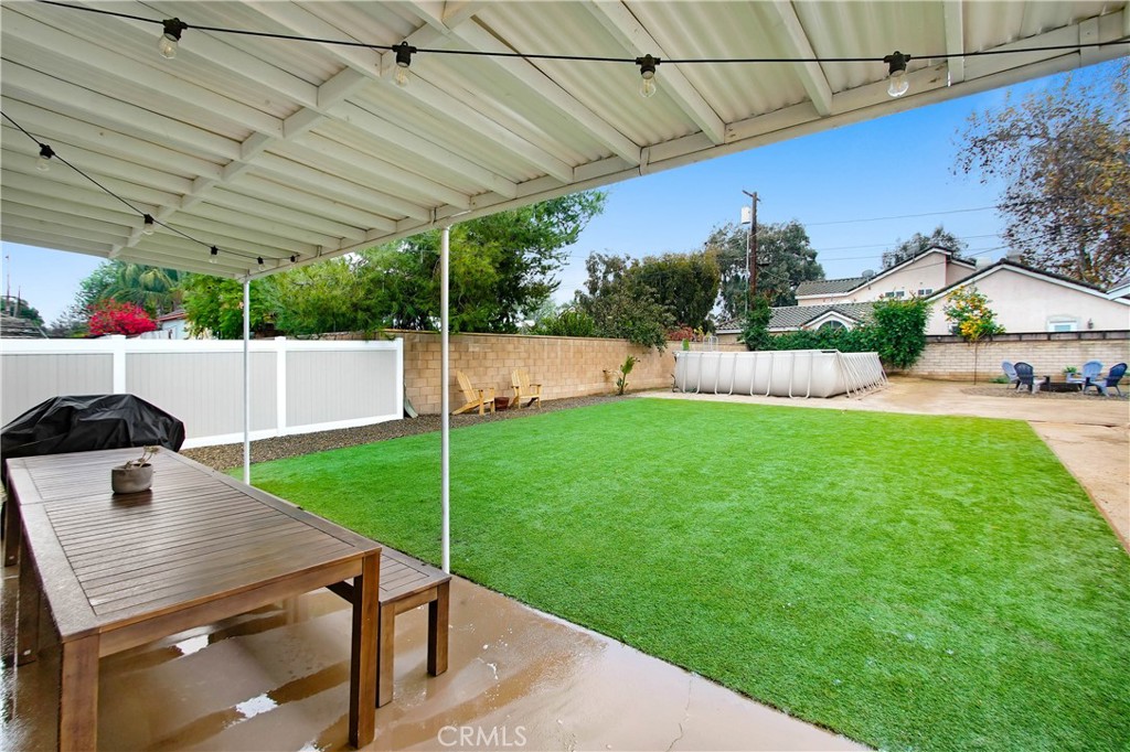 9732 Belmont Drive Riverside, CA 92503 - Photo 17 of 20 a view of a backyard with plants and a patio