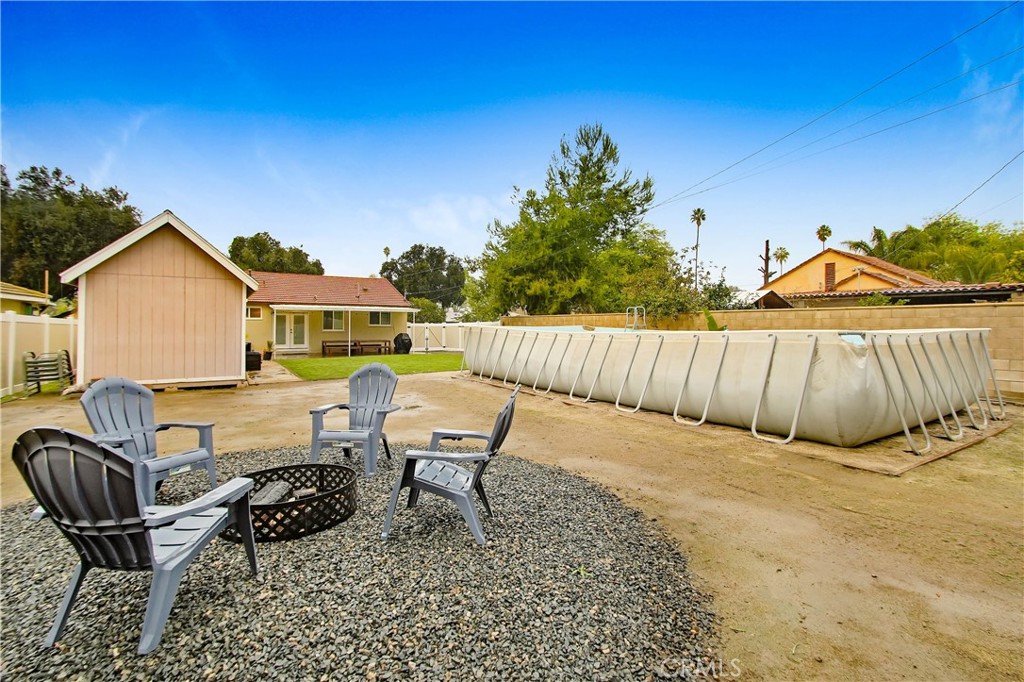 9732 Belmont Drive Riverside, CA 92503 - Photo 19 of 20 a backyard of a house with table and chairs
