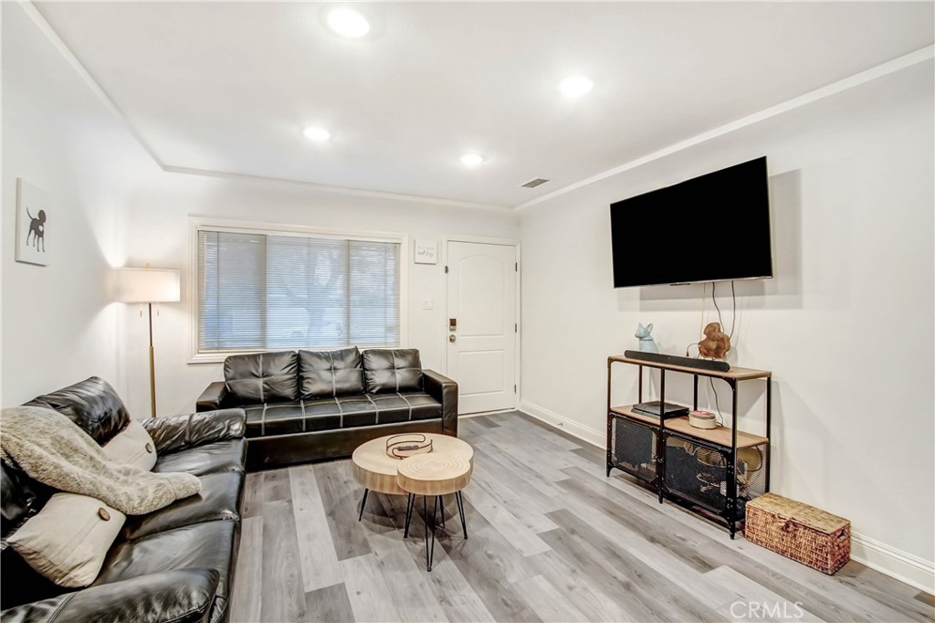 9732 Belmont Drive Riverside, CA 92503 - Photo 4 of 20 a living room with furniture and a flat screen tv