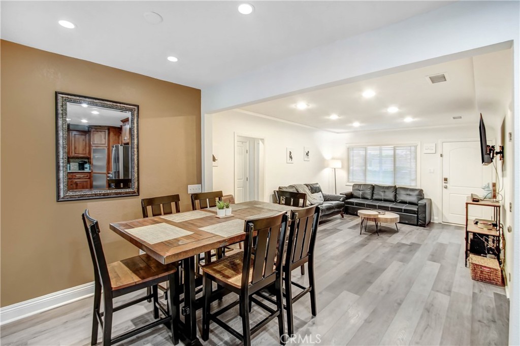9732 Belmont Drive Riverside, CA 92503 - Photo 8 of 20 a view of a dining room with furniture and wooden floor