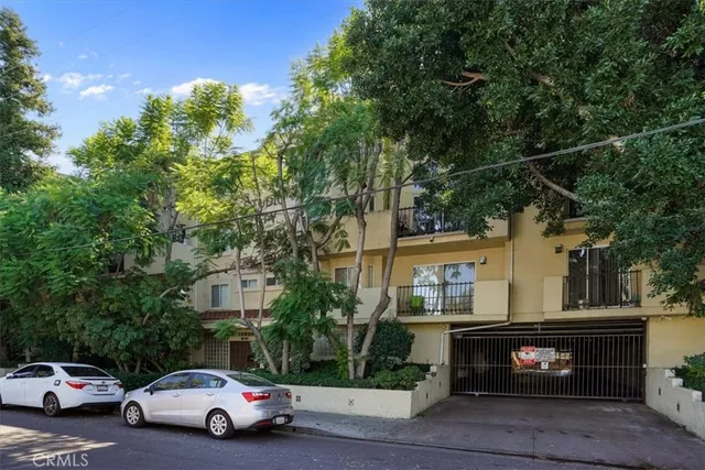 a view of street with parked cars