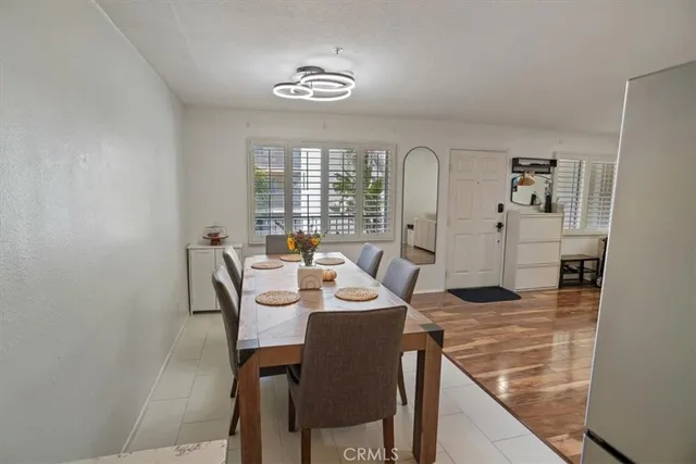 a view of a dining room with furniture and window