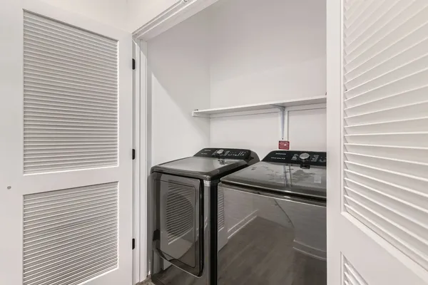 a view of hallway with wooden floor