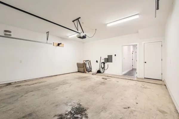 a view of entryway and gallery with wooden floor
