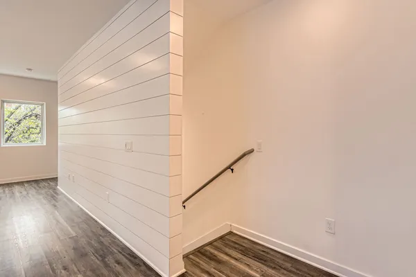 a view of entryway with wooden floor