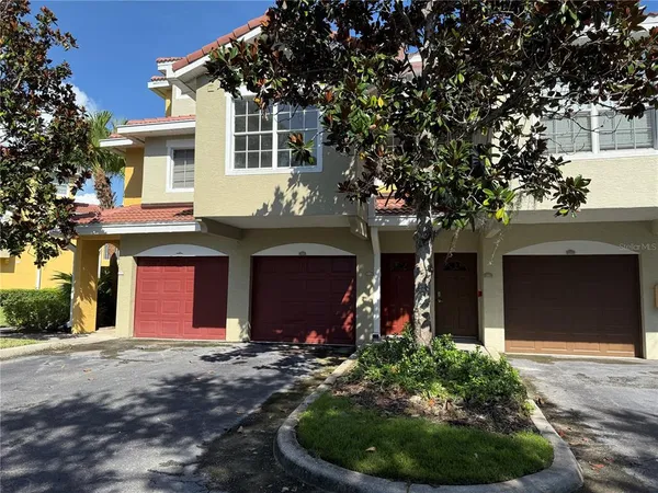 a front view of a house with yard