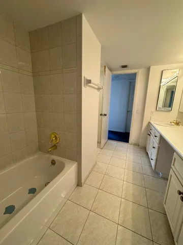 a bathroom with a bathtub and a sink
