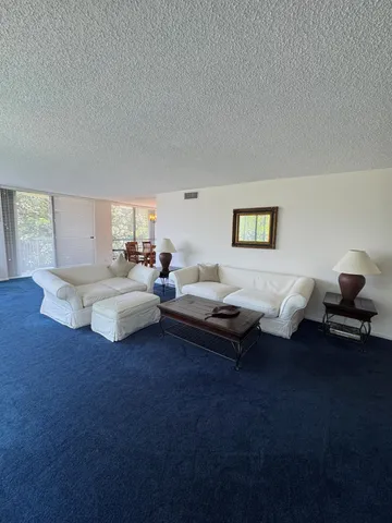 a living room with furniture window and a lamp
