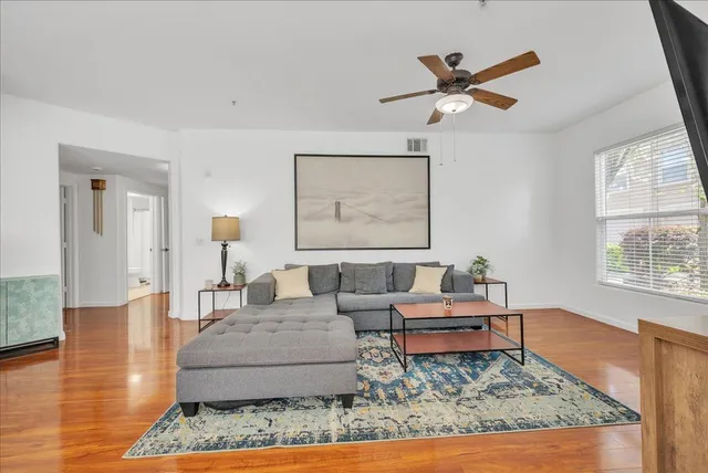 a living room with furniture and a rug
