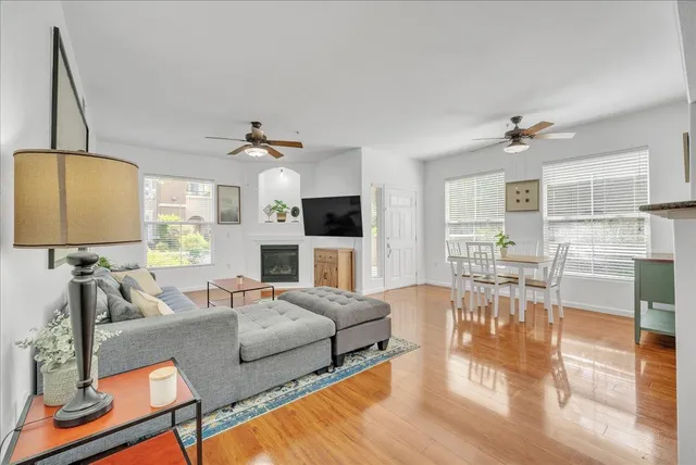 a living room with fireplace furniture and a flat screen tv