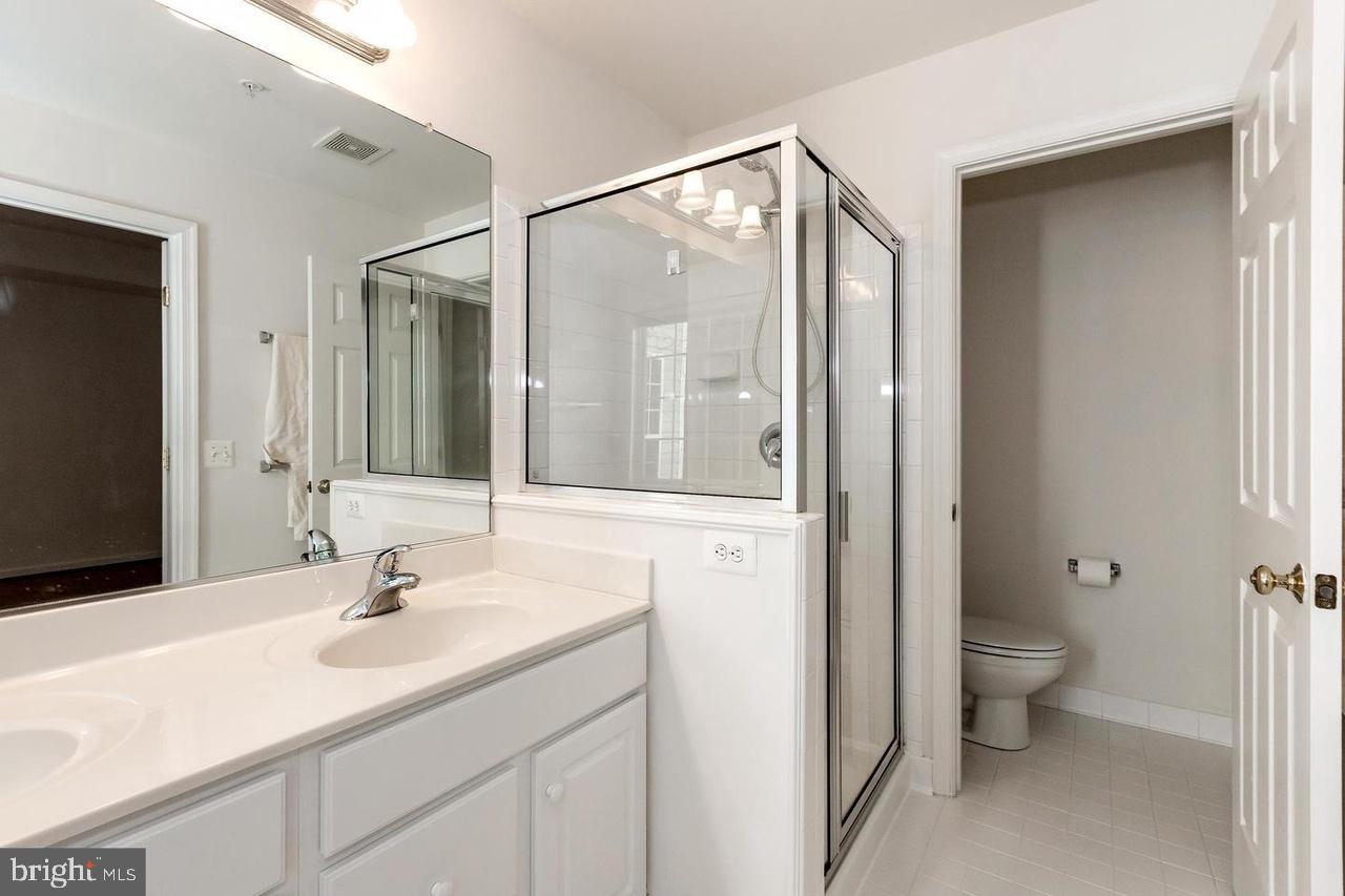 13953 Lullaby Road Germantown, MD 20874 - Photo 14 of 26 a bathroom with a sink and a mirror