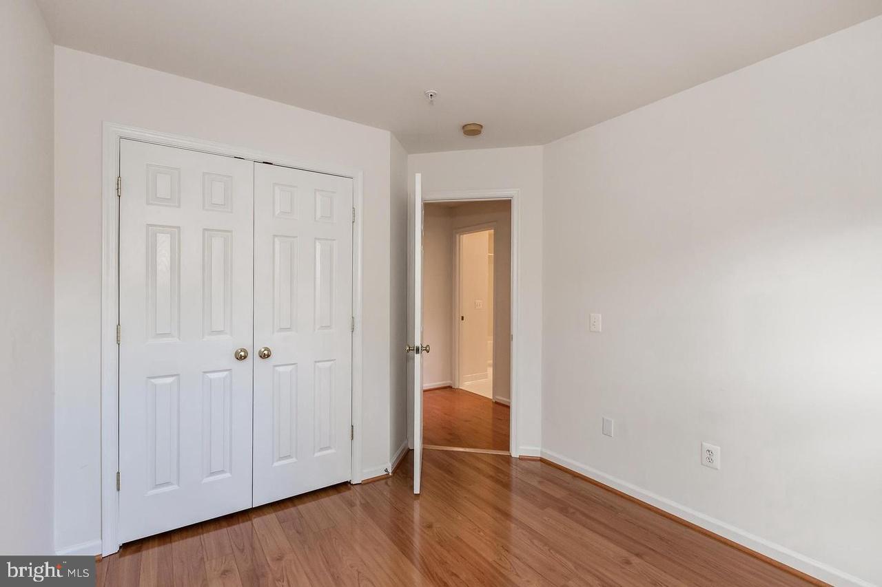 13953 Lullaby Road Germantown, MD 20874 - Photo 16 of 26 a view of an empty room and wooden floor