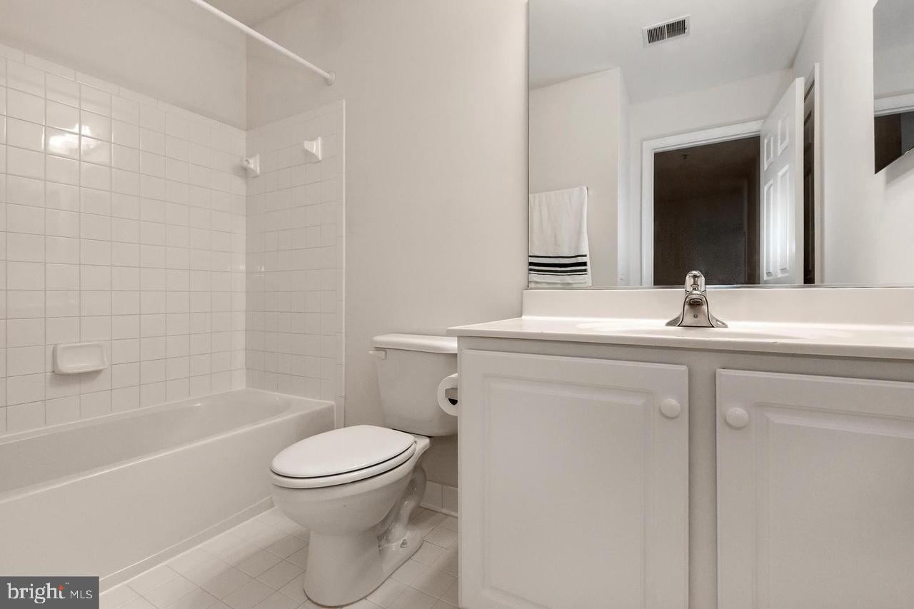 13953 Lullaby Road Germantown, MD 20874 - Photo 21 of 26 a bathroom with a sink toilet and shower