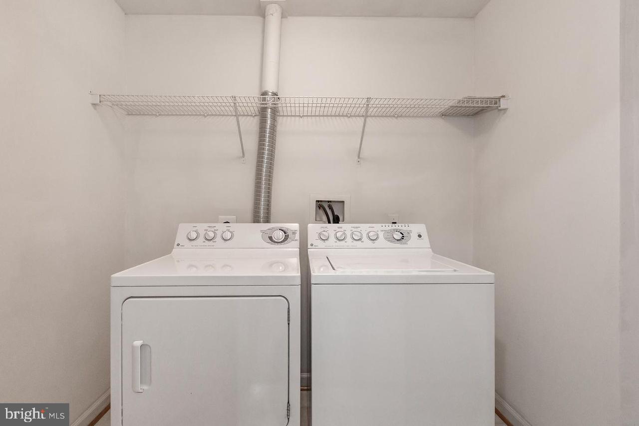 13953 Lullaby Road Germantown, MD 20874 - Photo 24 of 26 a utility room with dryer and washer
