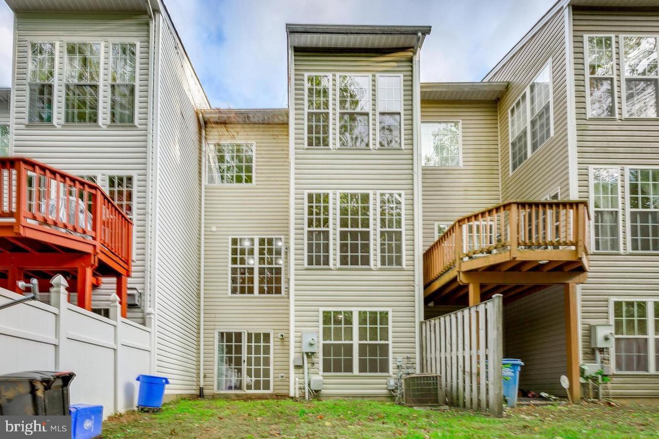 13953 Lullaby Road Germantown, MD 20874 - Photo 25 of 26 a front view of a house with a yard