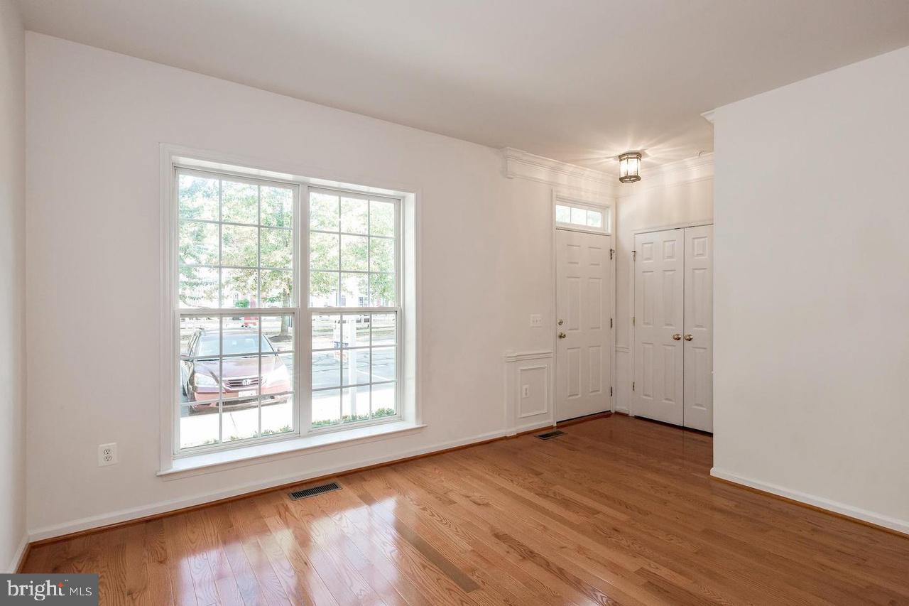 13953 Lullaby Road Germantown, MD 20874 - Photo 5 of 26 wooden floor in an empty room with a window