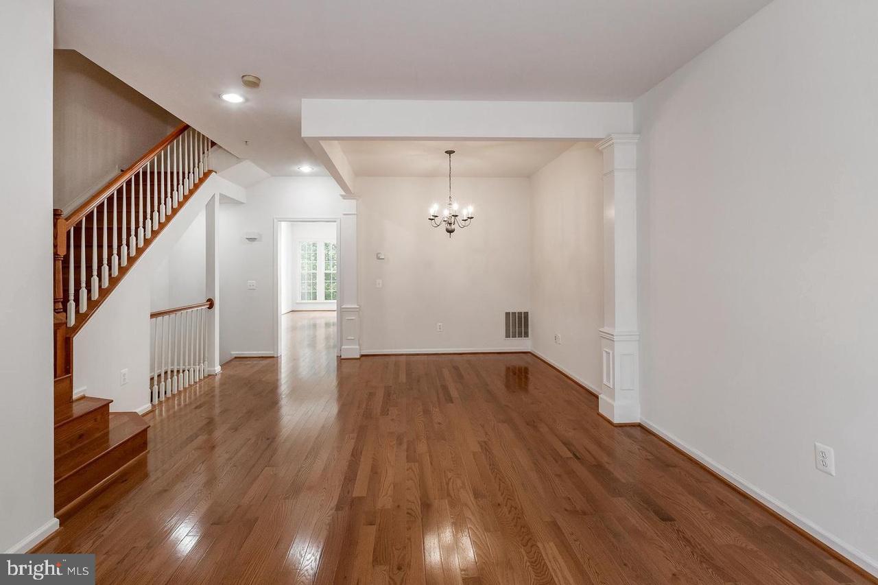 13953 Lullaby Road Germantown, MD 20874 - Photo 6 of 26 wooden floor in an empty room with wooden floor