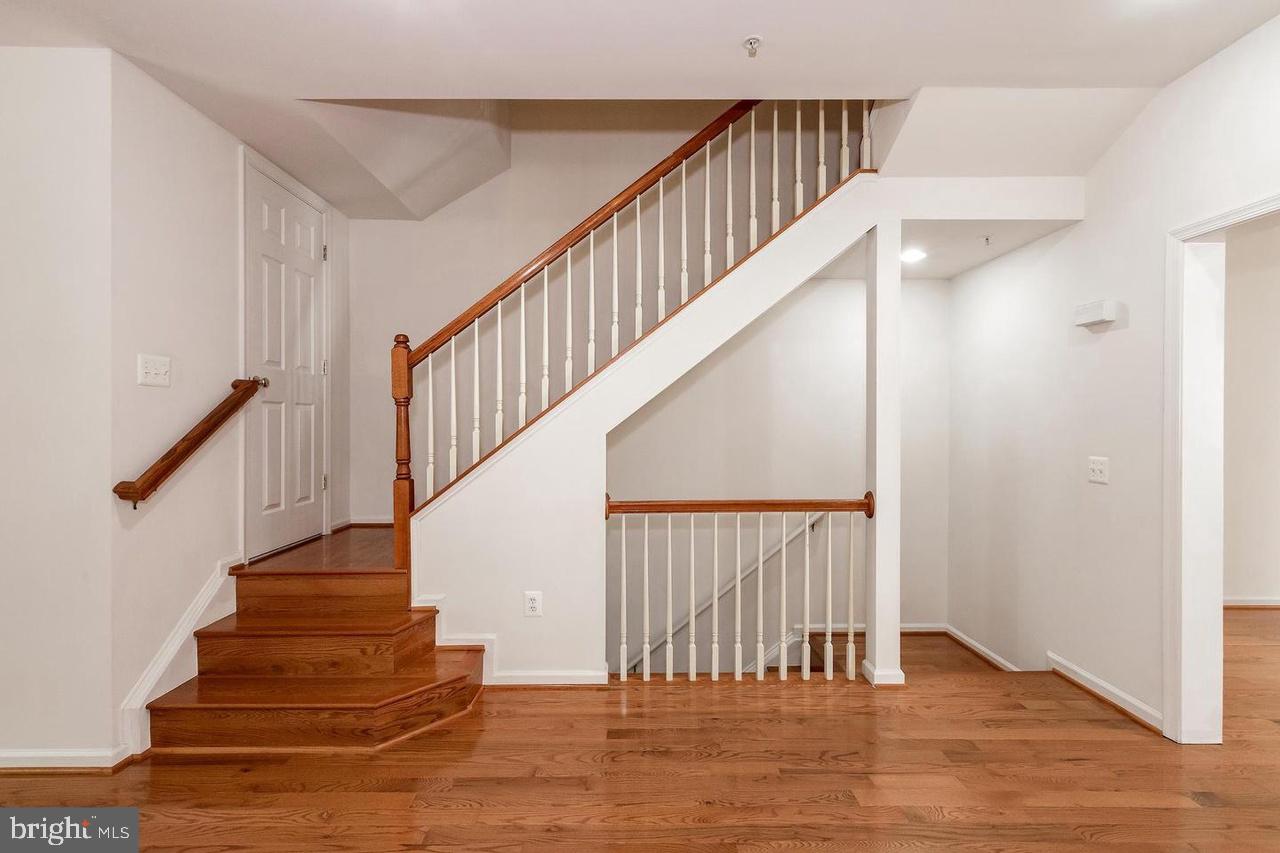 13953 Lullaby Road Germantown, MD 20874 - Photo 8 of 26 a view of entryway and hall with wooden floor