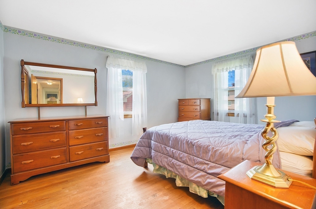 100 Mathieu Drive Chicopee, MA 01020 - Photo 12 of 37 a bedroom with a bed and a dresser