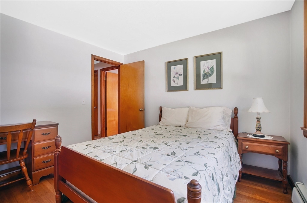 100 Mathieu Drive Chicopee, MA 01020 - Photo 18 of 37 a bedroom with a bed and a dresser