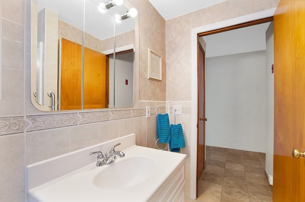 100 Mathieu Drive Chicopee, MA 01020 - Photo 21 of 37 a bathroom with a sink and a mirror