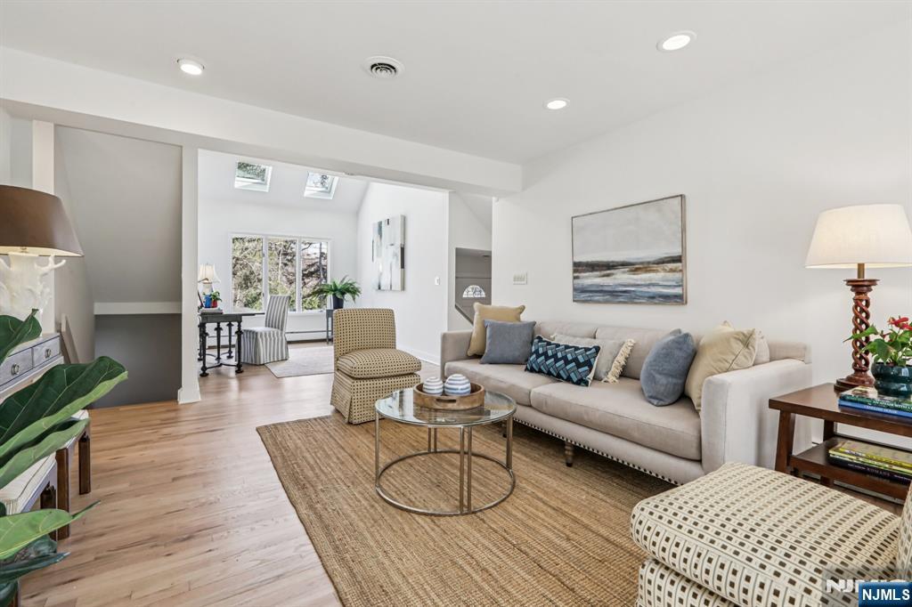 11 Carlough Road Upper Saddle River, NJ 07458 - Photo 20 of 41 a living room with furniture and a wooden floor