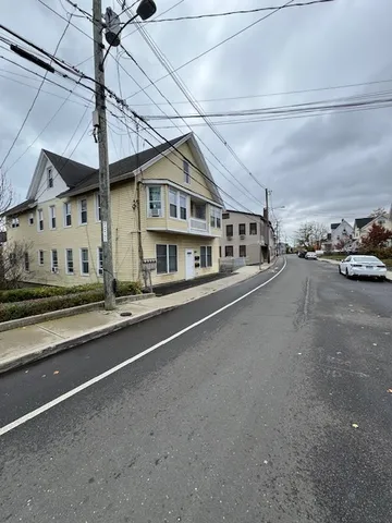 a view of a house with a street