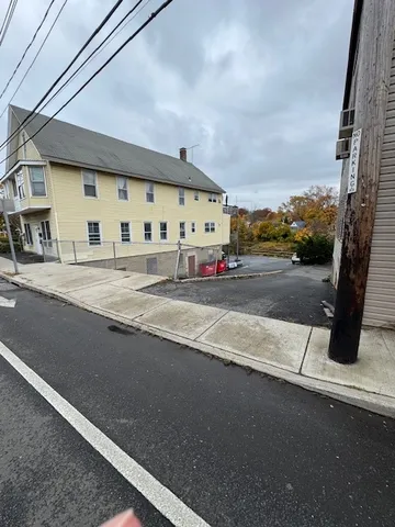 a view of a street with a building