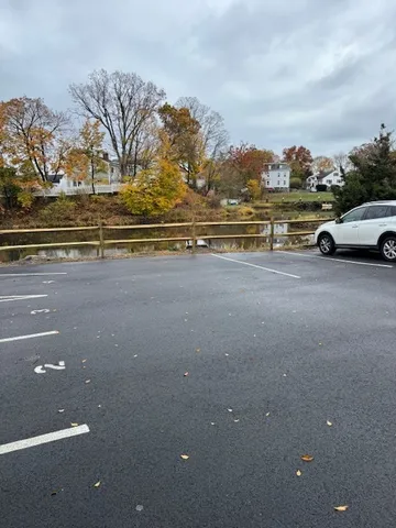 a view of car parked on the street