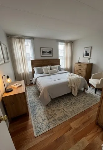 a bedroom with a bed and window