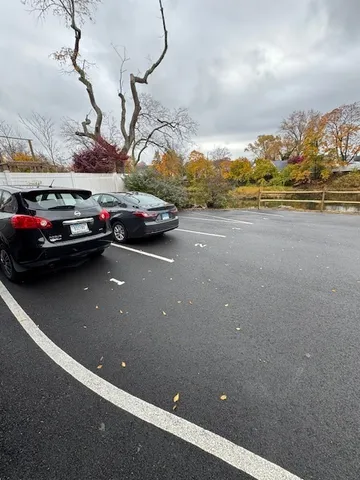 a view of a city street with cars