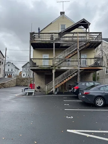 a view of a car park in front of a building
