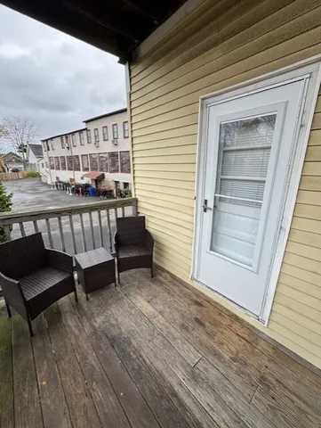 a view of a balcony with chairs
