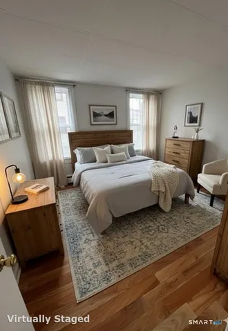 a bedroom with a bed and window