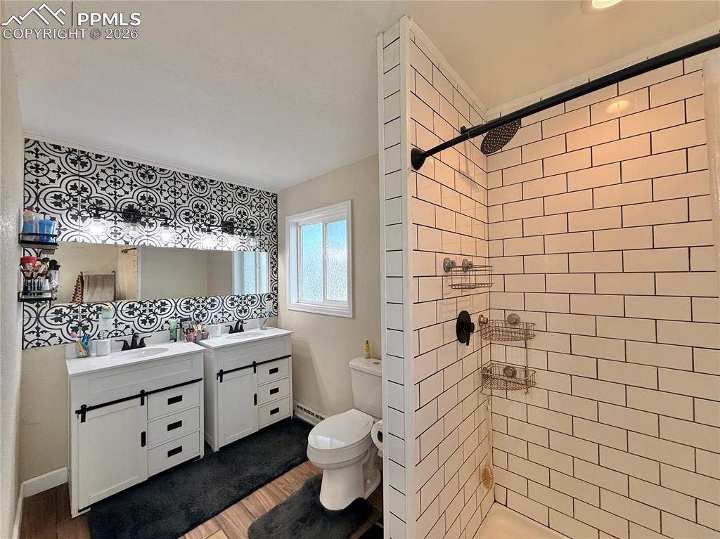58 Duke Street Pueblo, CO 81005 - Photo 15 of 35 a bathroom with a granite countertop sink toilet and shower