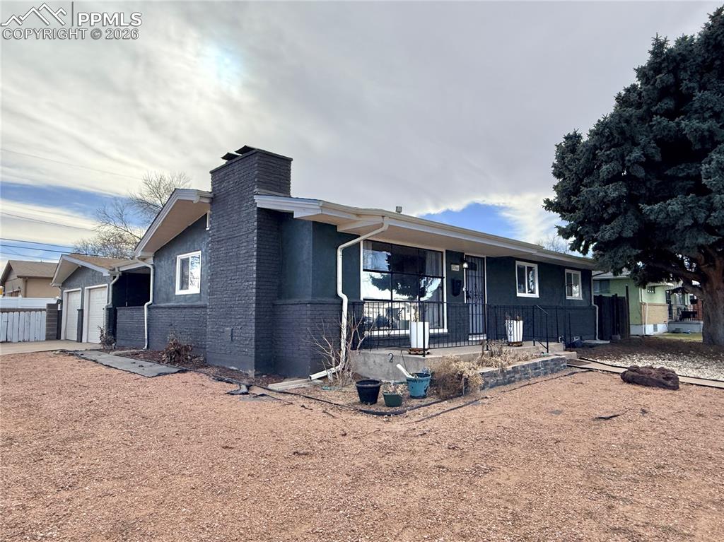 58 Duke Street Pueblo, CO 81005 - Photo 2 of 35 a front view of a house with yard patio and livingroom