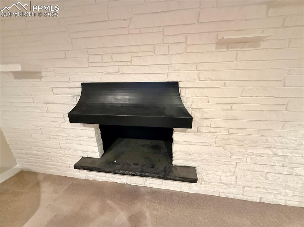 58 Duke Street Pueblo, CO 81005 - Photo 23 of 35 a fireplace with a wall
