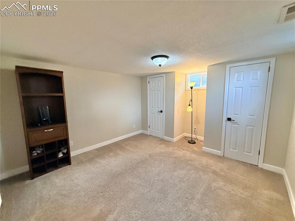58 Duke Street Pueblo, CO 81005 - Photo 24 of 35 an empty room with closet and natural light