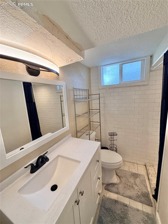 58 Duke Street Pueblo, CO 81005 - Photo 29 of 35 a bathroom with a sink toilet and shower