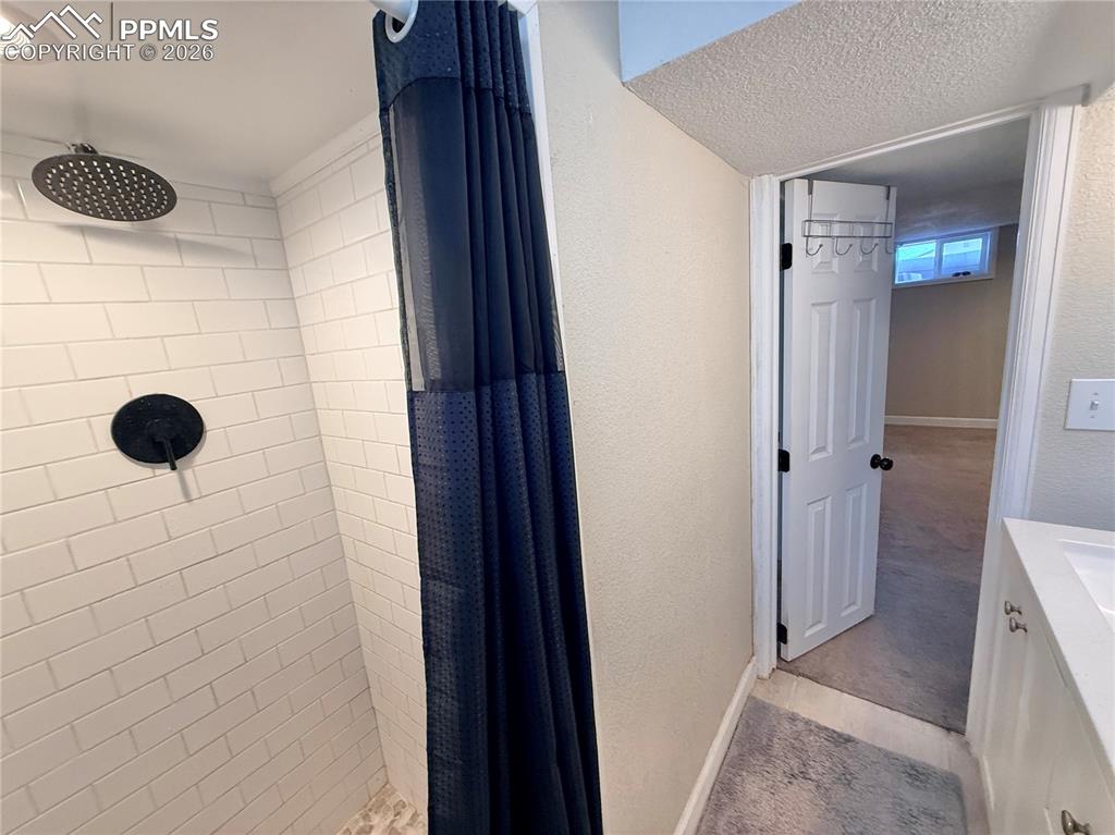 58 Duke Street Pueblo, CO 81005 - Photo 30 of 35 a bathroom with a shower and a window